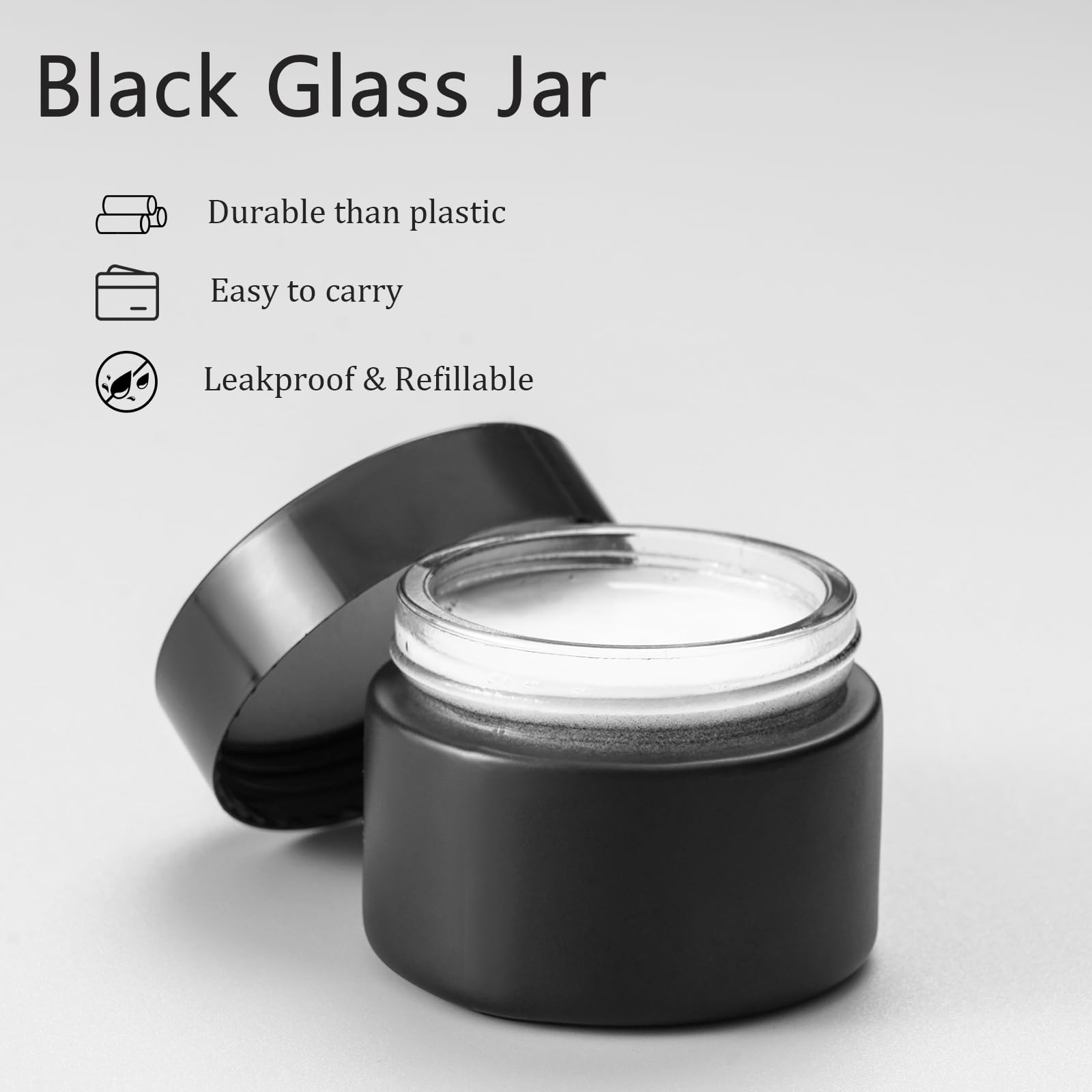 Black glass jar with open lid.
