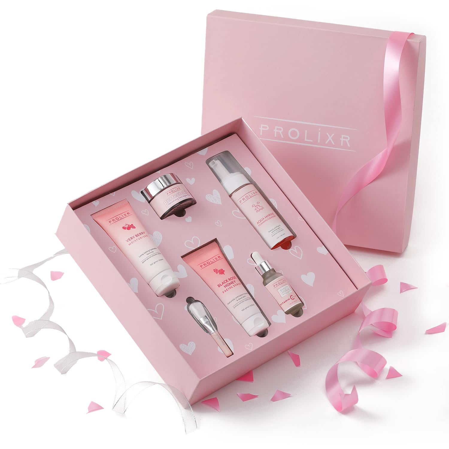 Elegant pink beauty gift set with assorted skincare products and ribbon.
