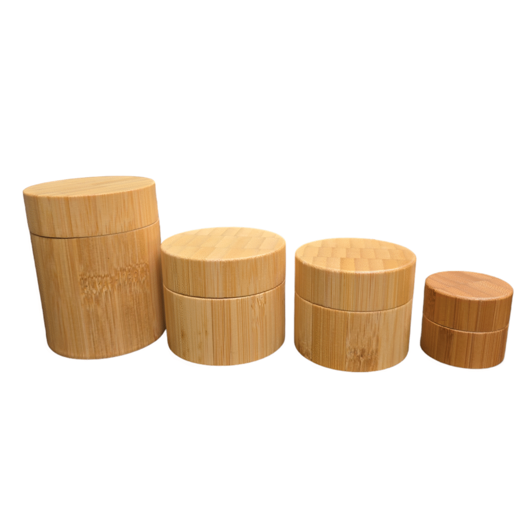 Four wooden cylindrical containers, different sizes.