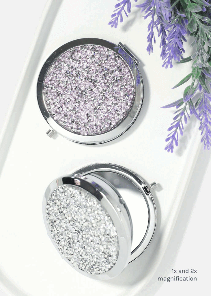Sparkling compact mirrors with glitter design.