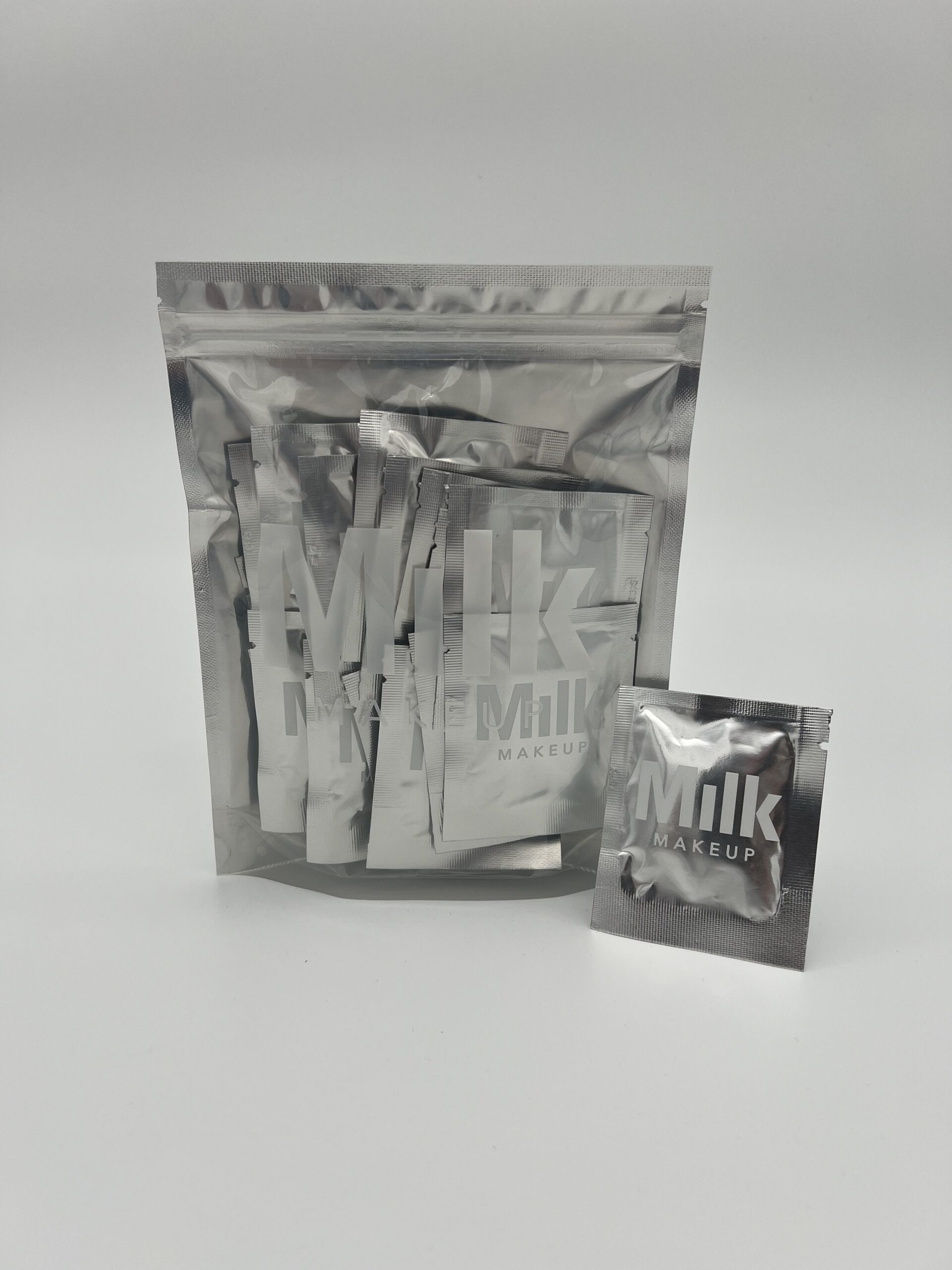 Packets of powdered milk with one small sachet outside the main package.