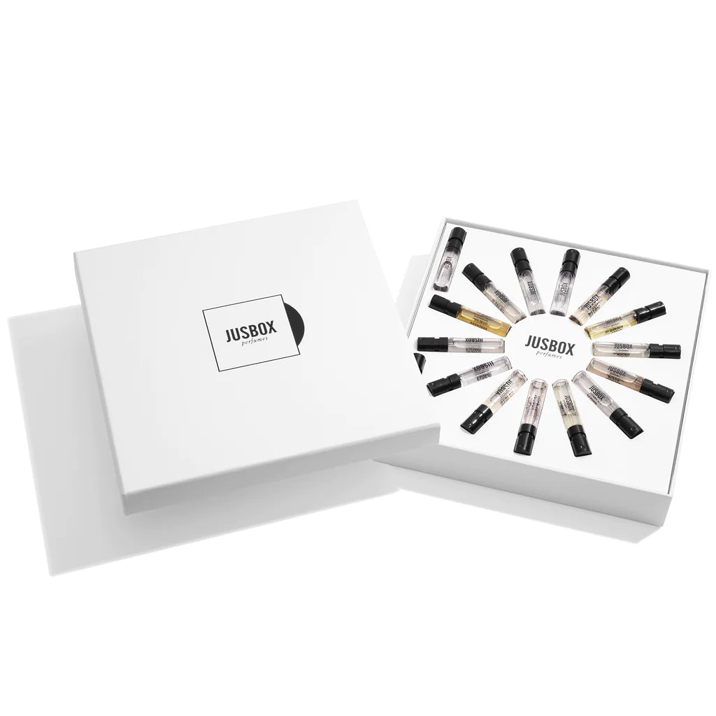 Elegant white box with twelve diverse lipstick shades arranged in a circle.