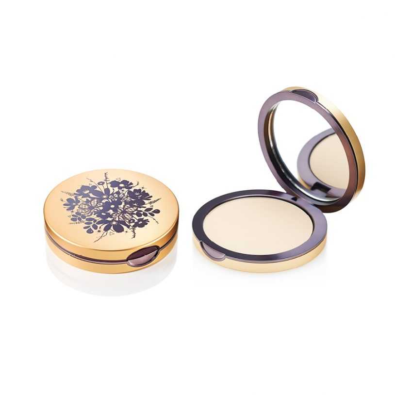 Gold floral compact with mirror open.