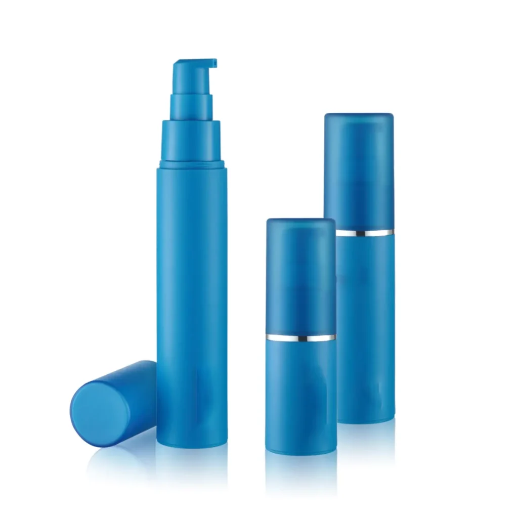 Blue cosmetic bottles with caps on a white background.