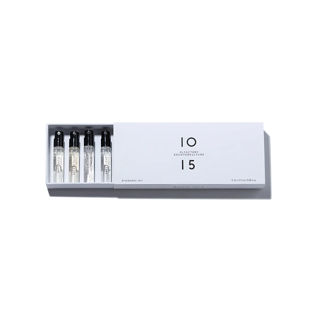 A white plastic thermometer strip displaying temperature readings.