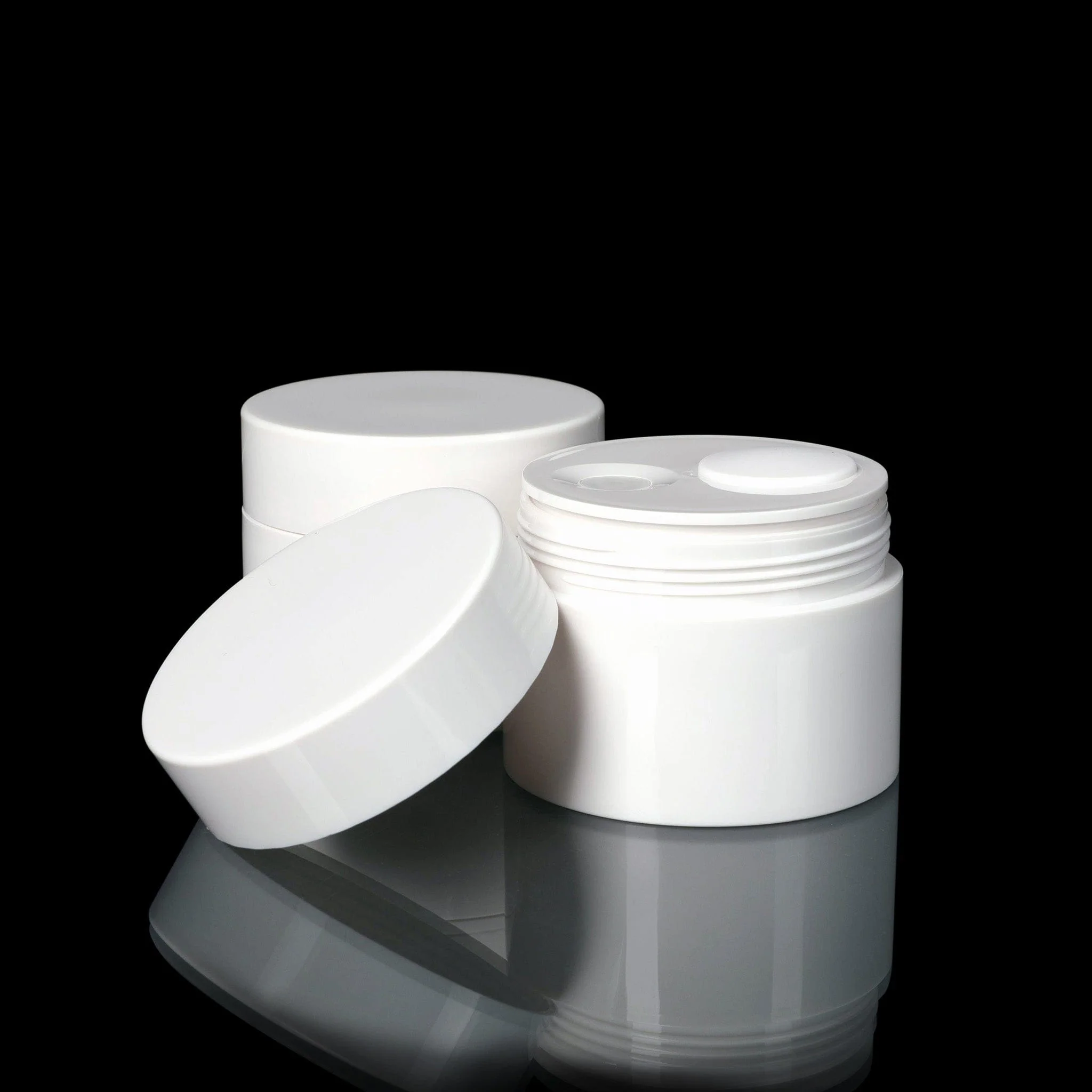 White 50ml airless cosmetic jar with cap.