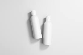 Two plain white plastic bottles with caps on a white background.