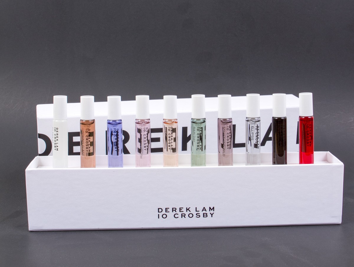A row of colorful chocolate bars with unique designs on a white display.